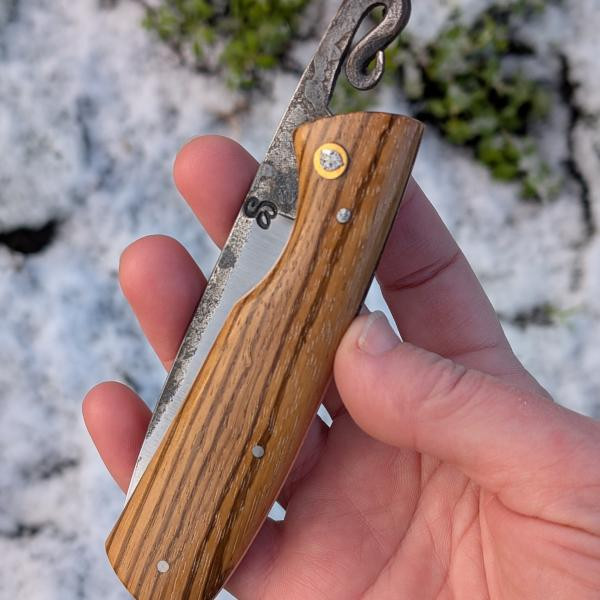 Nagha 399, pliant en zébrano